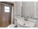 Bright bathroom with a tiled shower, modern toilet and updated sink and vanity at 259 S Polk Dr, Sarasota, FL 34236