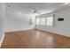 Spacious bedroom with natural lighting, hardwood floors, and a ceiling fan at 259 S Polk Dr, Sarasota, FL 34236