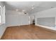 Bright bedroom featuring hardwood floors, large closets, and a ceiling fan for optimal comfort at 259 S Polk Dr, Sarasota, FL 34236