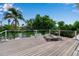 Spacious deck overlooking tranquil pond, perfect for relaxing and entertaining at 259 S Polk Dr, Sarasota, FL 34236