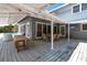 Expansive patio featuring covered area, outdoor furniture, and access to the pool at 259 S Polk Dr, Sarasota, FL 34236