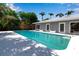 Beautiful backyard pool area with access to the house and a sunny deck at 259 S Polk Dr, Sarasota, FL 34236