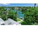 Picturesque waterfront view with lush greenery, a private boat dock, and luxurious waterfront properties, ideal for boaters at 259 S Polk Dr, Sarasota, FL 34236