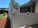 Backyard featuring a white fence, small amount of grass and mulch, and a black truck at 2606 29Th Ave W # 12, Bradenton, FL 34205