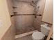 Bathroom shower featuring tiled walls and floor with built-in shelves at 2606 29Th Ave W # 12, Bradenton, FL 34205
