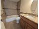 Bathroom with tiled shower, tub combo, and granite countertops at 2606 29Th Ave W # 12, Bradenton, FL 34205