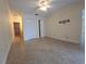 Bedroom featuring neutral walls, tile floors, and a ceiling fan at 2606 29Th Ave W # 12, Bradenton, FL 34205