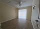 Bedroom with a ceiling fan, closet, and sliding glass door at 2606 29Th Ave W # 12, Bradenton, FL 34205