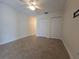Bedroom with neutral paint and tile floors at 2606 29Th Ave W # 12, Bradenton, FL 34205