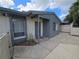 Exterior view of a well-maintained home, showcasing the property's entrance and a view of the surrounding landscape at 2606 29Th Ave W # 12, Bradenton, FL 34205