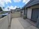 The exterior view features a charming walkway leading to the home's entrance, complemented by a privacy fence and lush surroundings at 2606 29Th Ave W # 12, Bradenton, FL 34205