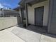 View of the front door and small front yard area with a Welcome mat at 2606 29Th Ave W # 12, Bradenton, FL 34205