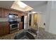 Modern kitchen features stainless steel appliances, granite countertops, and ample cabinet space at 2606 29Th Ave W # 12, Bradenton, FL 34205