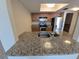 Kitchen with stainless steel appliances, granite countertops and wood cabinets at 2606 29Th Ave W # 12, Bradenton, FL 34205