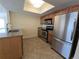 Bright kitchen with granite countertops, stainless steel appliances, and ample cabinet space at 2606 29Th Ave W # 12, Bradenton, FL 34205
