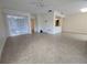 Open-concept living room featuring tile flooring and a breakfast bar at 2606 29Th Ave W # 12, Bradenton, FL 34205