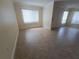 Bright and airy living room featuring neutral wall colors, tiled floors, and large windows offering ample natural light at 2606 29Th Ave W # 12, Bradenton, FL 34205