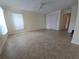 Spacious living room featuring tile floors, neutral walls and a ceiling fan at 2606 29Th Ave W # 12, Bradenton, FL 34205
