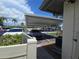 Carport parking area with multiple vehicles, providing covered parking at 2606 29Th Ave W # 12, Bradenton, FL 34205