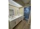 Modern bathroom with double sink vanity, tile floors and glass enclosed shower at 3810 75Th W St # 137, Bradenton, FL 34209