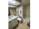 Bathroom featuring a modern vanity, toilet, and shower with a bee-themed curtain at 3810 75Th W St # 137, Bradenton, FL 34209