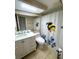 Bathroom featuring a modern vanity, toilet, and shower with a bee-themed curtain at 3810 75Th W St # 137, Bradenton, FL 34209