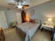 Well-lit bedroom with ceiling fan, closet, and bedside tables at 3810 75Th W St # 137, Bradenton, FL 34209
