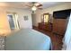 Bedroom featuring a ceiling fan, hardwood floors and ensuite bath at 3810 75Th W St # 137, Bradenton, FL 34209