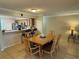 Lovely dining space featuring tile flooring and seamless transition to kitchen at 3810 75Th W St # 137, Bradenton, FL 34209