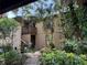 Exterior view of home showcasing mature trees, a courtyard and balcony at 3810 75Th W St # 137, Bradenton, FL 34209