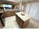 Convenient kitchen layout with an island and plenty of storage, adjacent to living spaces at 3810 75Th W St # 137, Bradenton, FL 34209