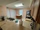 Traditional kitchen featuring stainless steel appliances, tile floors and a central island at 3810 75Th W St # 137, Bradenton, FL 34209