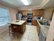 Practical kitchen featuring an island with seating and stainless steel appliances at 3810 75Th W St # 137, Bradenton, FL 34209