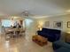 Open concept living and dining space with tile floors and bright lighting at 3810 75Th W St # 137, Bradenton, FL 34209