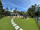 A community pool area with lounge chairs and umbrellas invites residents to relax and enjoy the outdoors at 3810 75Th W St # 137, Bradenton, FL 34209