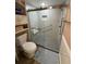 Shower featuring glass door, storage shelf and towel rack at 3810 75Th W St # 137, Bradenton, FL 34209