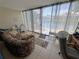 Relaxing sunroom with waterfront view, desk, and comfortable seating at 3810 75Th W St # 137, Bradenton, FL 34209