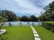 A picturesque view of a community tennis court showcases recreation opportunities and the community's active lifestyle at 3810 75Th W St # 137, Bradenton, FL 34209