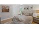 Cozy bedroom with neutral tones, a comfortable bed, and natural light at 3936 Santa Caterina Blvd, Bradenton, FL 34211