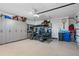 Organized garage with ample storage cabinets and space for a golf cart at 3936 Santa Caterina Blvd, Bradenton, FL 34211