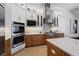 Bright gourmet kitchen with stainless steel appliances and a spacious center island at 3936 Santa Caterina Blvd, Bradenton, FL 34211