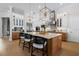 Gourmet kitchen with a large island, stainless steel appliances, and modern lighting fixtures at 3936 Santa Caterina Blvd, Bradenton, FL 34211