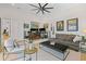 Comfortable living room with a sofa, workstation, and views of the outdoors at 3936 Santa Caterina Blvd, Bradenton, FL 34211