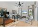 Stylish living room with a ceiling fan, hardwood floors, and a view of the outdoors at 3936 Santa Caterina Blvd, Bradenton, FL 34211