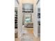 Elegant main bedroom with a chandelier, neutral color palette and view of the pool at 3936 Santa Caterina Blvd, Bradenton, FL 34211