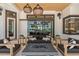 Cozy outdoor living area featuring comfortable seating, a stone fire pit, and stylish decor with beautiful accents at 3936 Santa Caterina Blvd, Bradenton, FL 34211