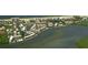 Waterfront condos with pools, docks, and tropical landscaping offer a luxurious coastal living experience at 4380 Exeter Dr # 204, Longboat Key, FL 34228