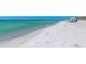 Expansive white sand beach with clear turquoise water, perfect for relaxation and recreation at 4380 Exeter Dr # 204, Longboat Key, FL 34228