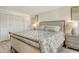 Comfortable bedroom with a large bed, two side tables and closet at 4380 Exeter Dr # 204, Longboat Key, FL 34228