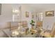 Bright dining area with stylish seating, open to the kitchen, perfect for Gathering meals at 4380 Exeter Dr # 204, Longboat Key, FL 34228
